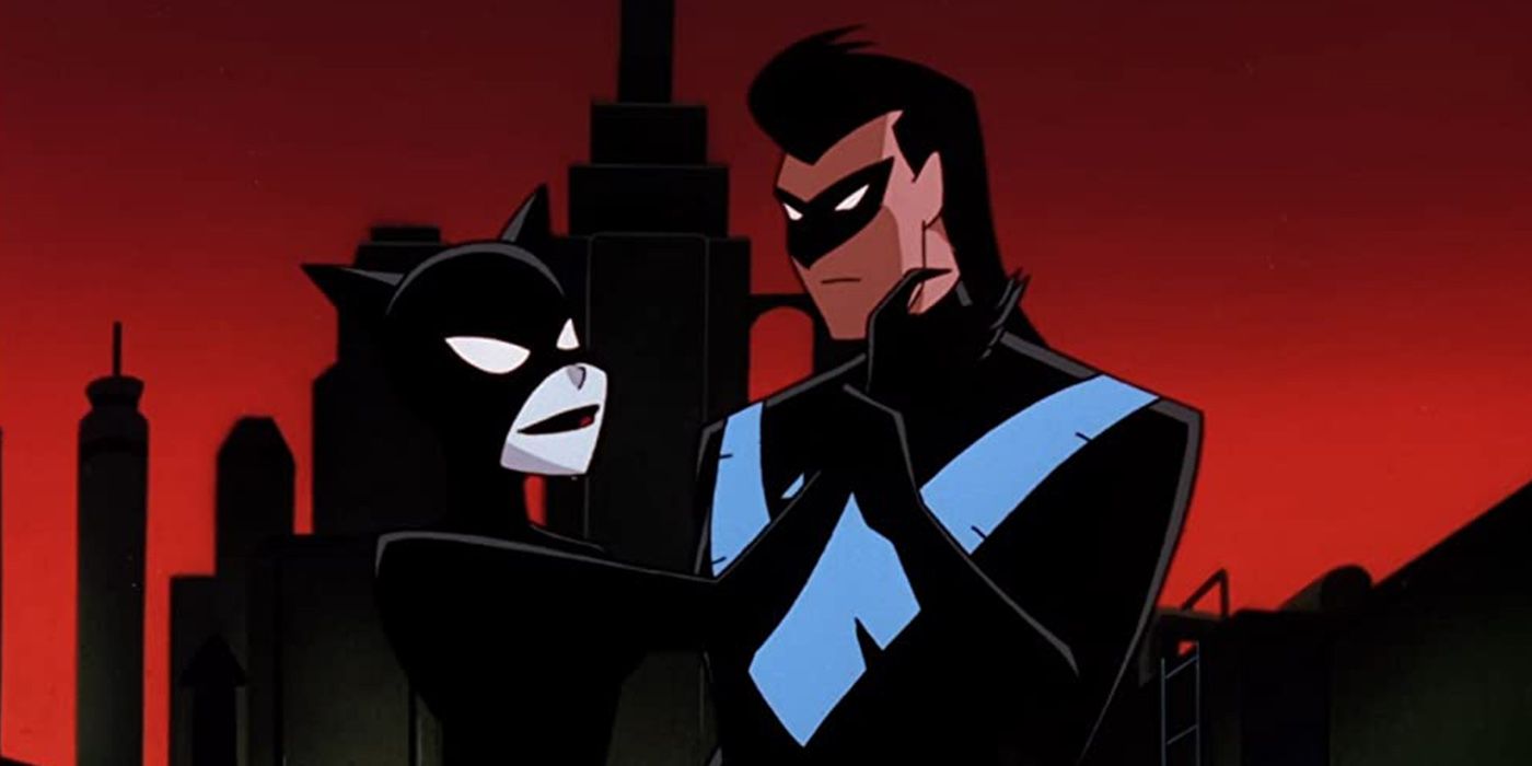 Nightwing en Catwoman op een dak in Gotham