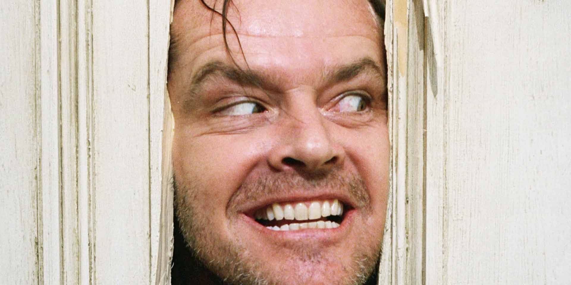 Jack Torrance breekt door een deur in The Shining