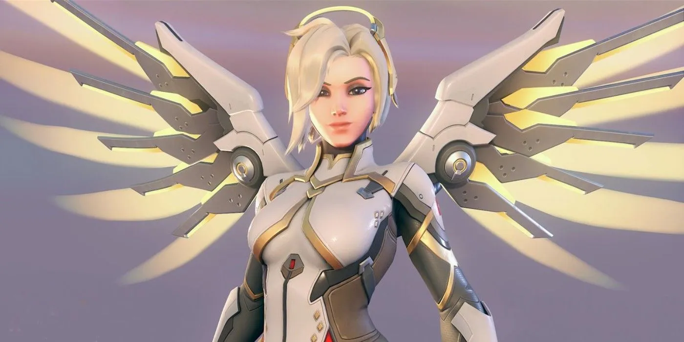 Mercy, een genezer uit Overwatch 2, kijkt in de camera en lacht met haar mechanische vleugels naar buiten gespreid.