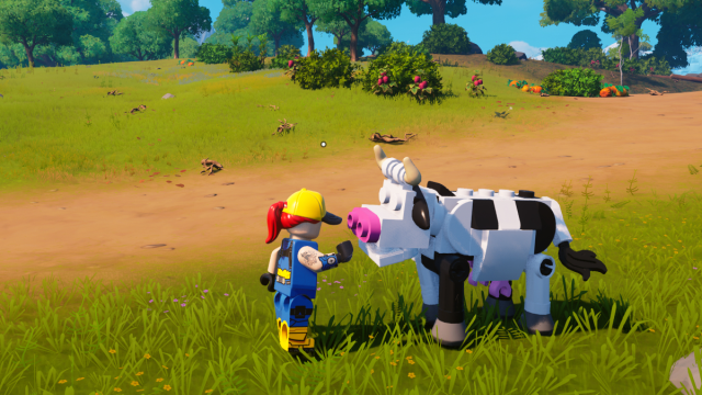 Een speler die een koe aait in LEGO Fortnite.